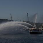 Seattle Fire Department boats move by in a cloud of spray. -Source: Brian M. Westbrook & KING 5